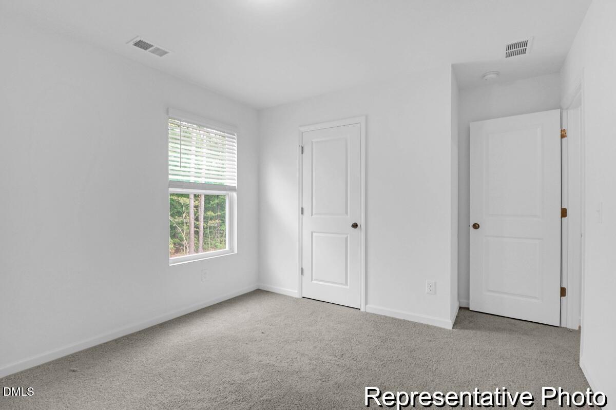 40 Birchstone Trail, Unit 225P Erwin, NC 28339 - Photo 24 of 26 a view of an empty room with a window