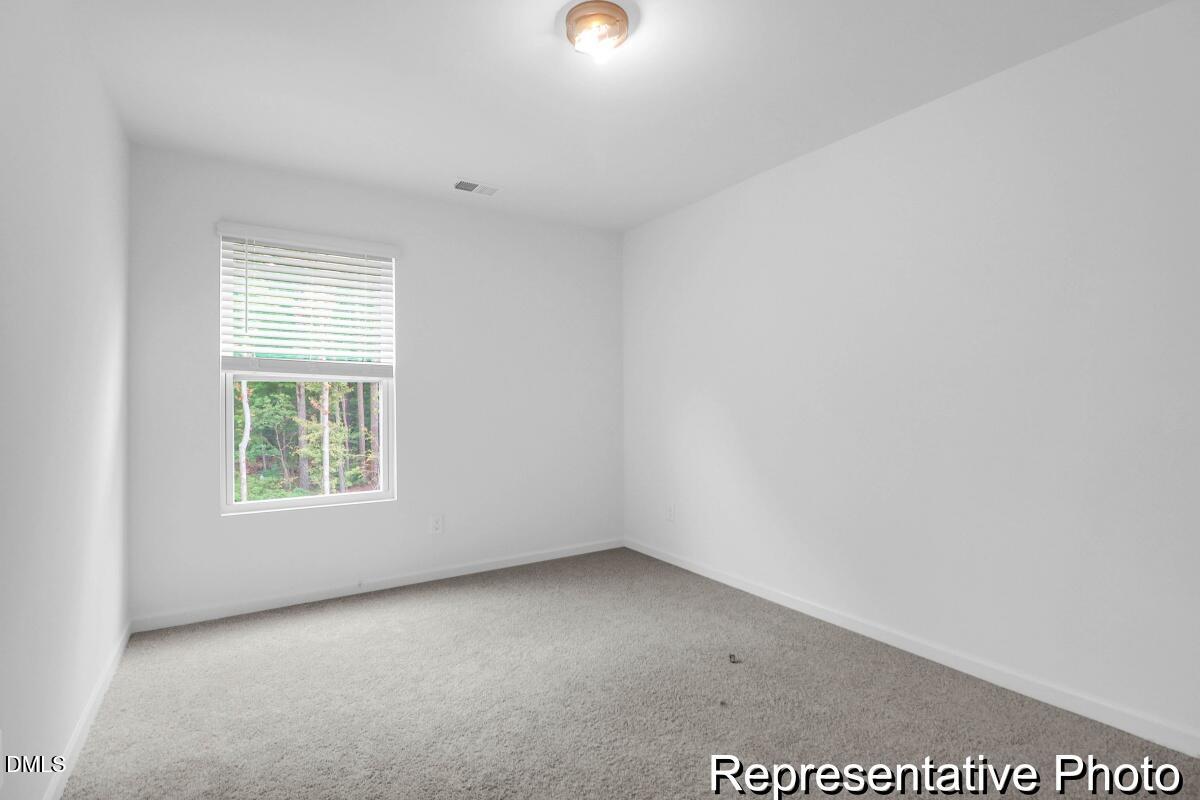 40 Birchstone Trail, Unit 225P Erwin, NC 28339 - Photo 25 of 26 an empty room with windows
