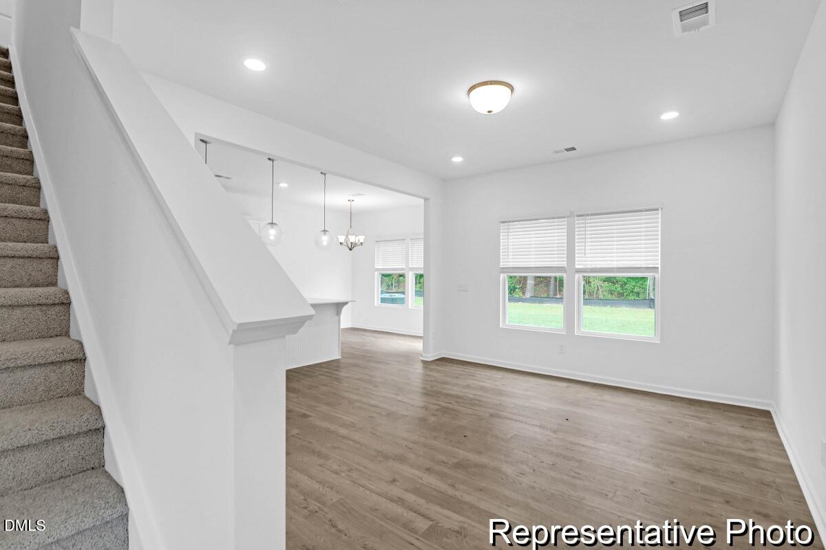 40 Birchstone Trail, Unit 225P Erwin, NC 28339 - Photo 3 of 26 a view of an empty room with wooden floor and a window