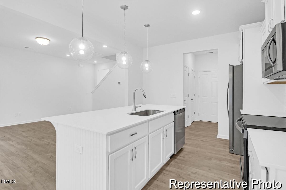 40 Birchstone Trail, Unit 225P Erwin, NC 28339 - Photo 9 of 26 a bathroom with a sink a toilet a mirror and shower