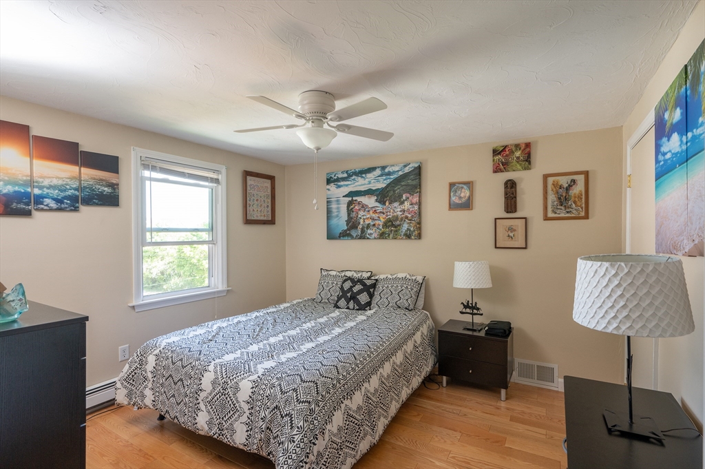 29 Wituwamat Road Weymouth, MA 02191 - Photo 30 of 42 a bedroom with a bed and a window