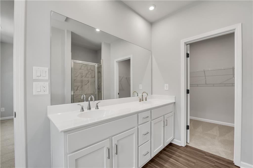 644 Devon Alley Acworth, GA 30102 - Photo 25 of 32 a bathroom with double sink and mirror