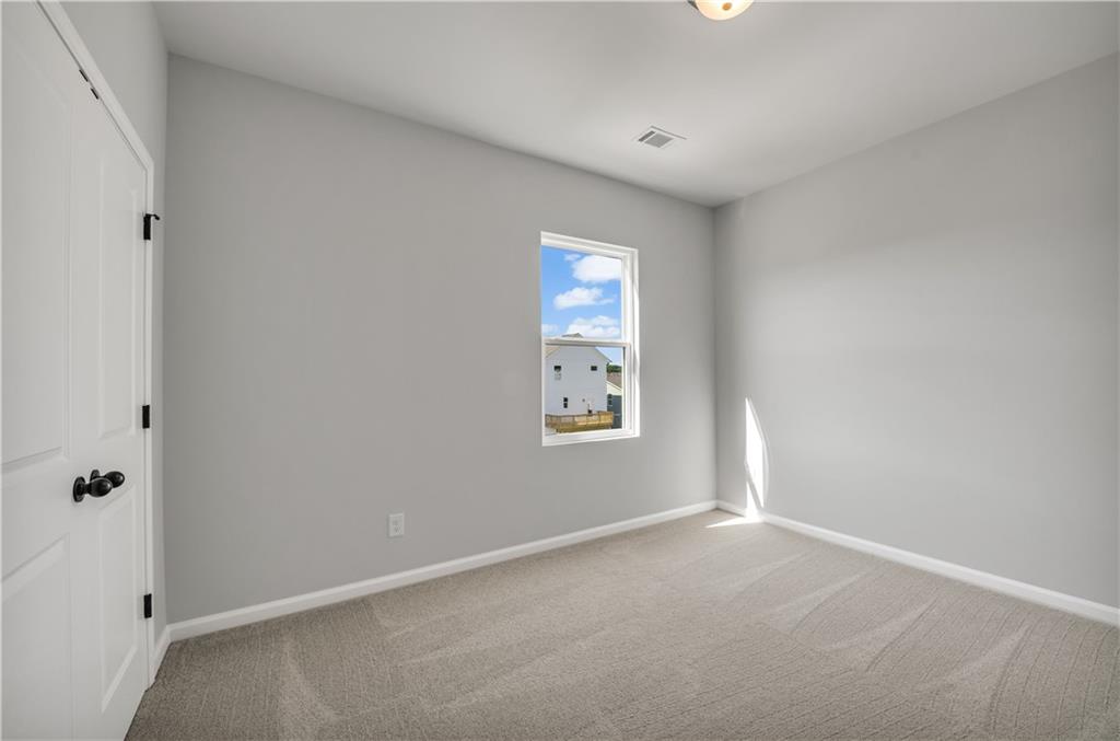 644 Devon Alley Acworth, GA 30102 - Photo 29 of 32 an empty room with windows