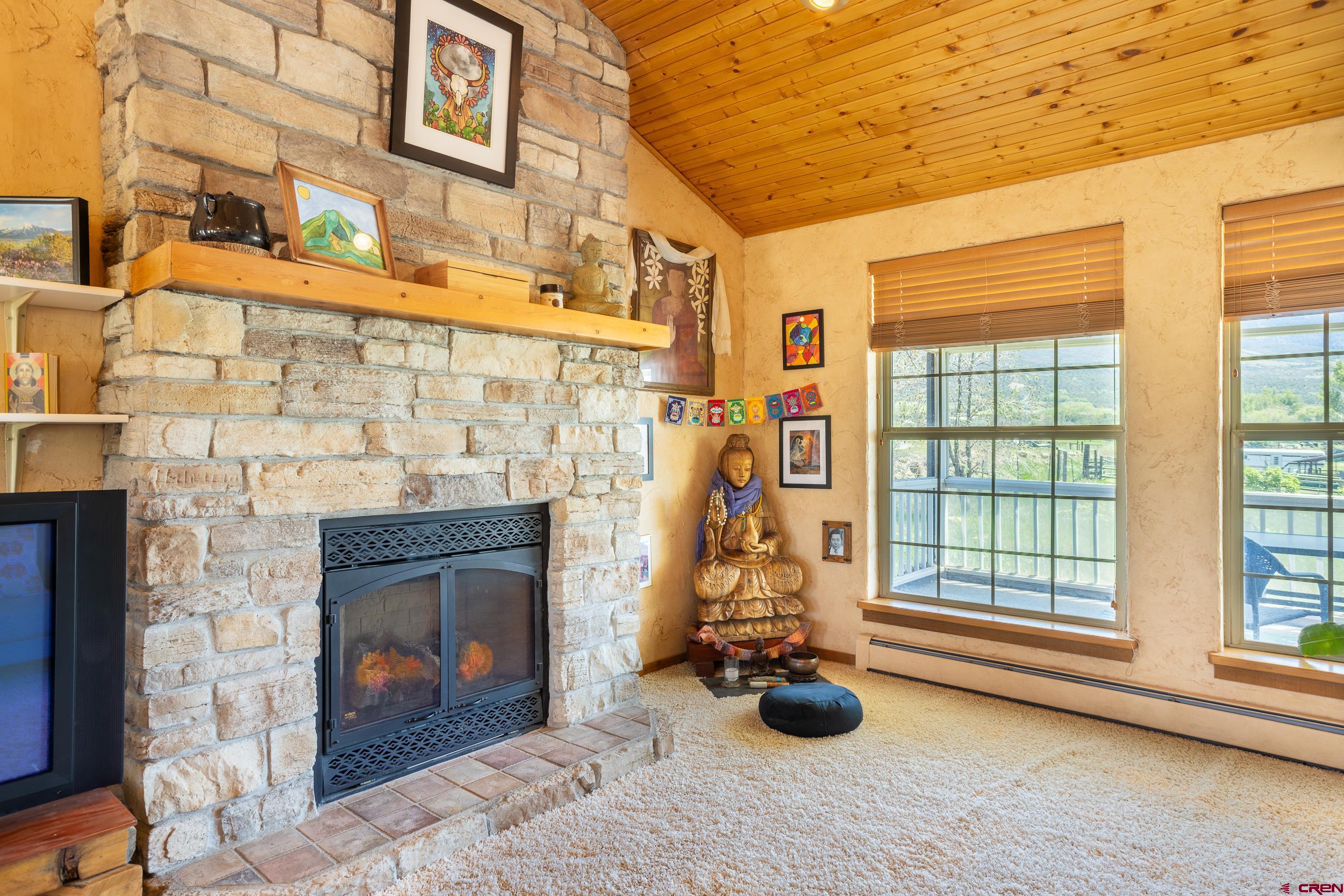 42224 Foothills Road Paonia, CO 81428 - Photo 26 of 40 a view of livingroom with furniture and a fireplace