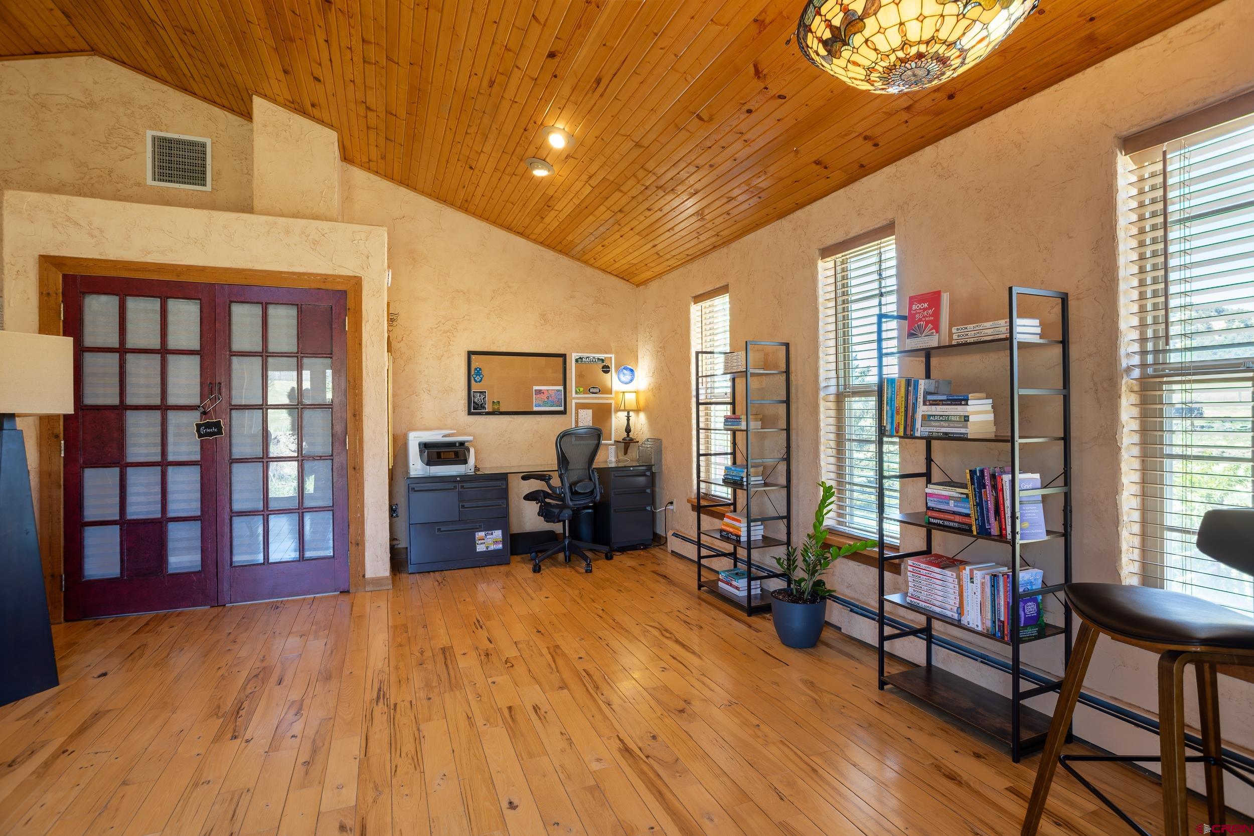 42224 Foothills Road Paonia, CO 81428 - Photo 27 of 40 a living room filled with furniture and a book shelf