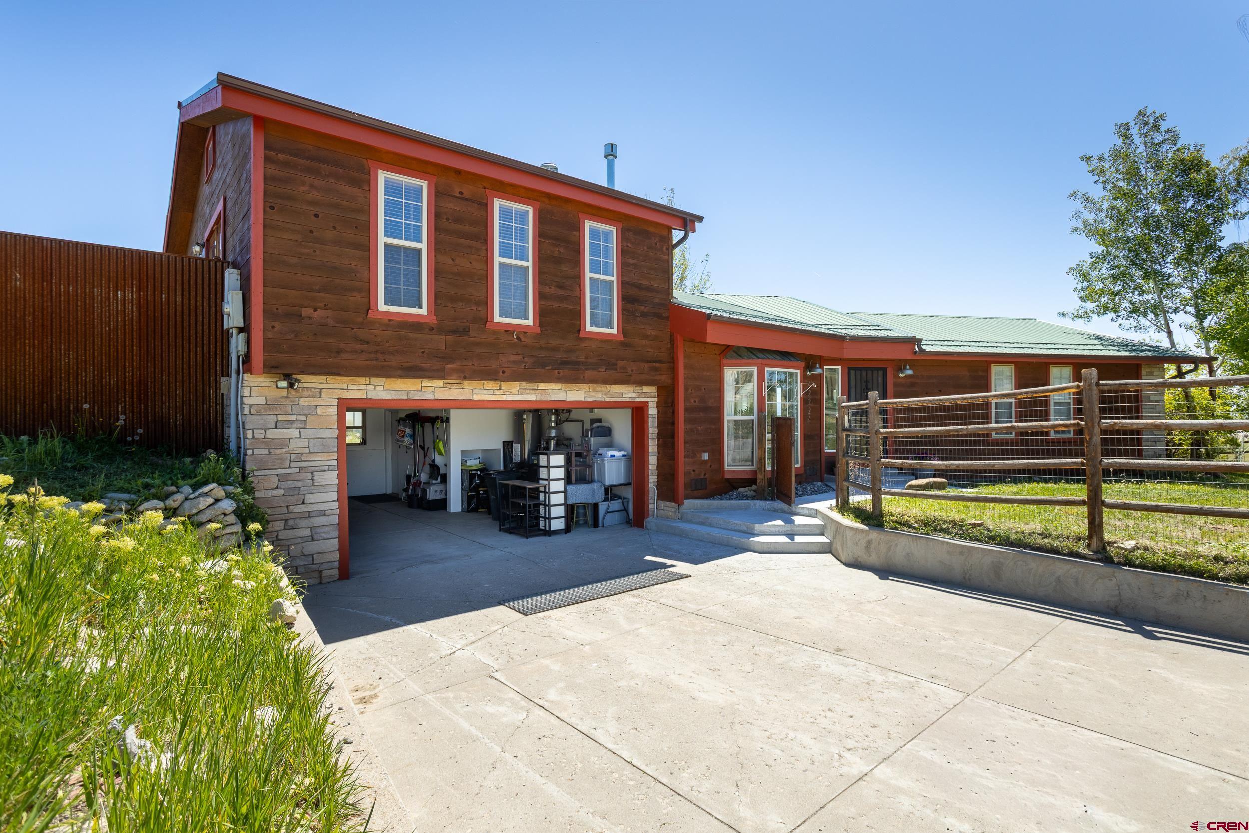 42224 Foothills Road Paonia, CO 81428 - Photo 29 of 40 a view of house with outdoor seating and covered with wooden fence