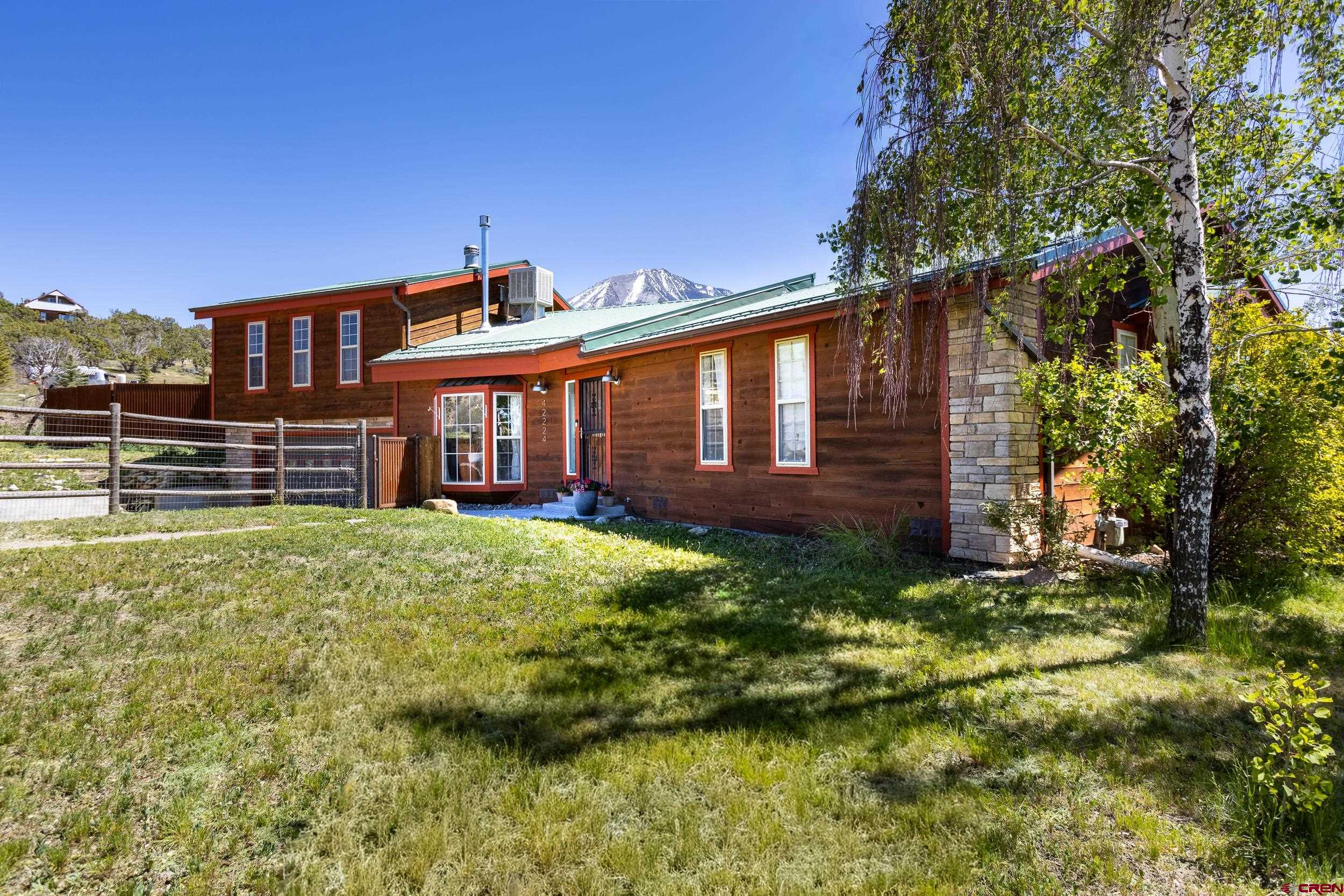 42224 Foothills Road Paonia, CO 81428 - Photo 31 of 40 a front view of a house with a garden