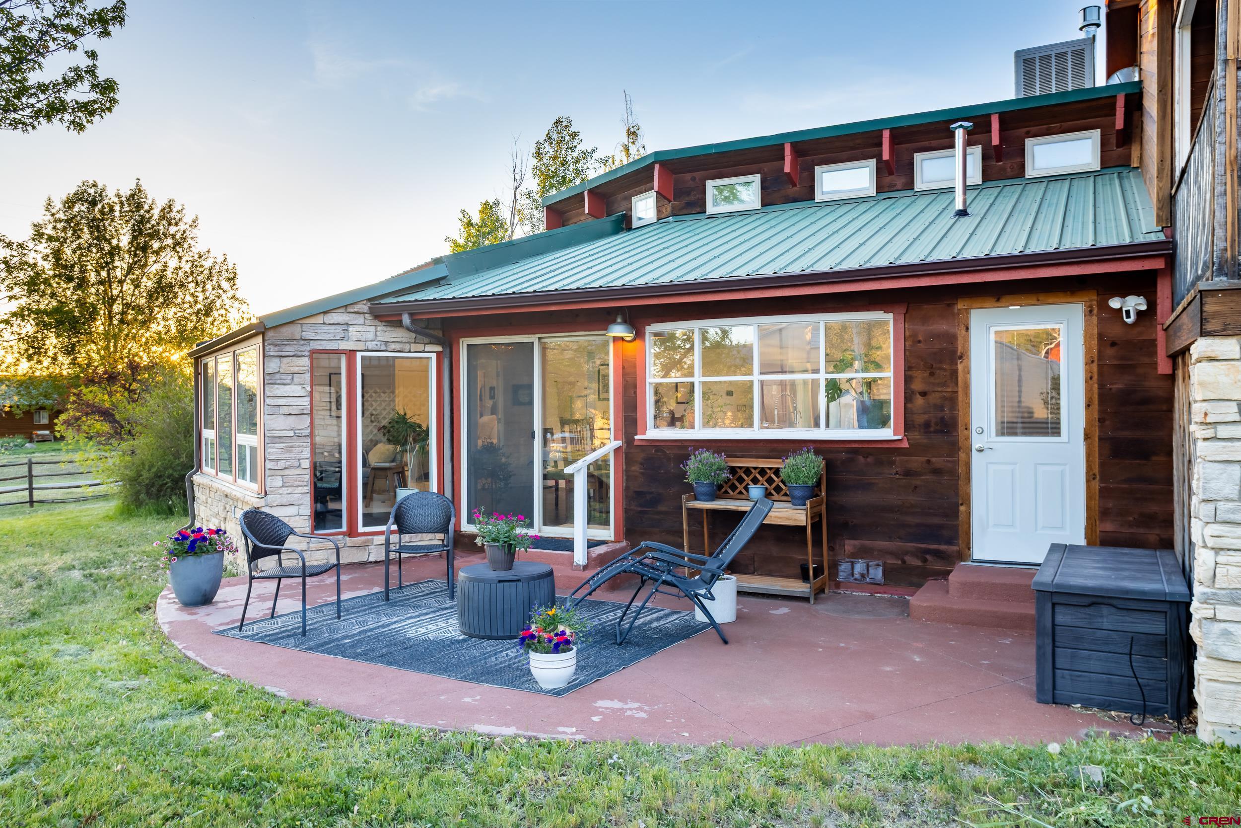 42224 Foothills Road Paonia, CO 81428 - Photo 33 of 40 a view of a house with backyard porch and sitting area