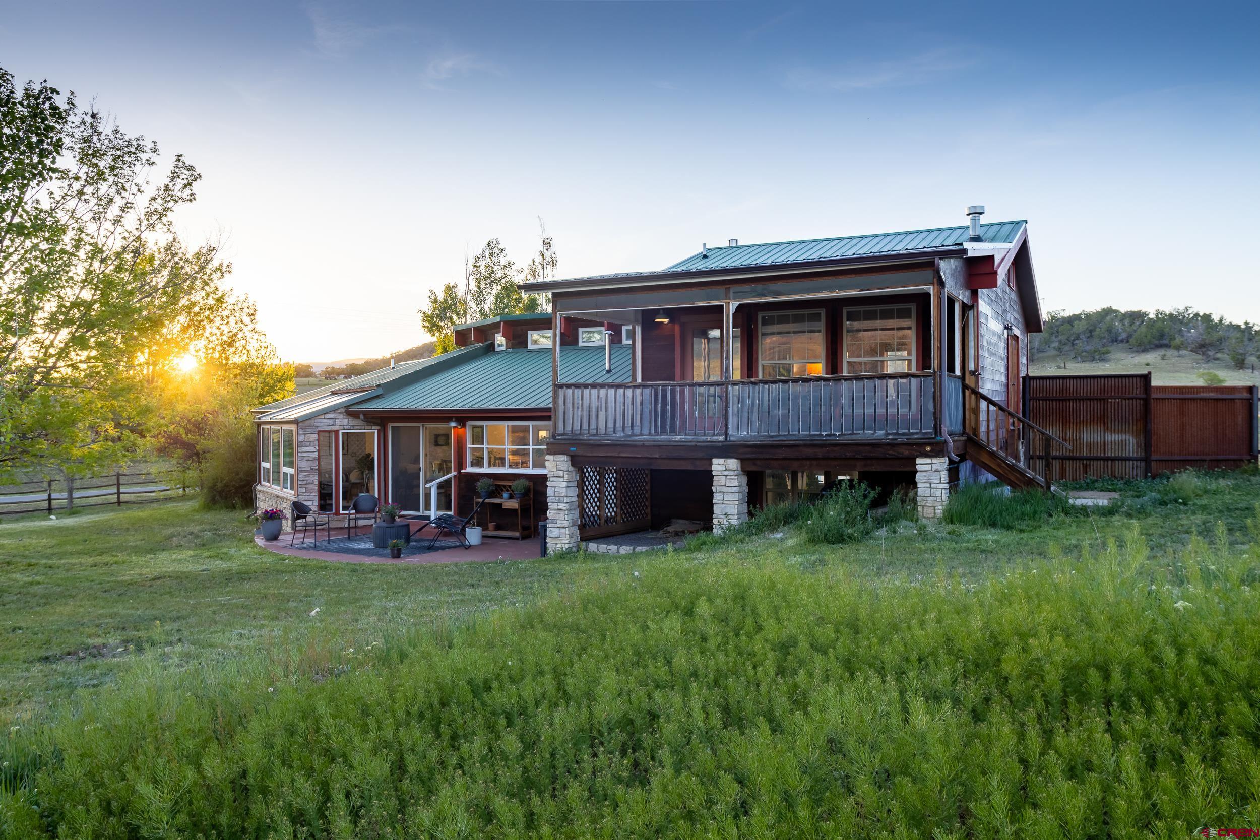 42224 Foothills Road Paonia, CO 81428 - Photo 37 of 40 a view of a house with a yard and deck