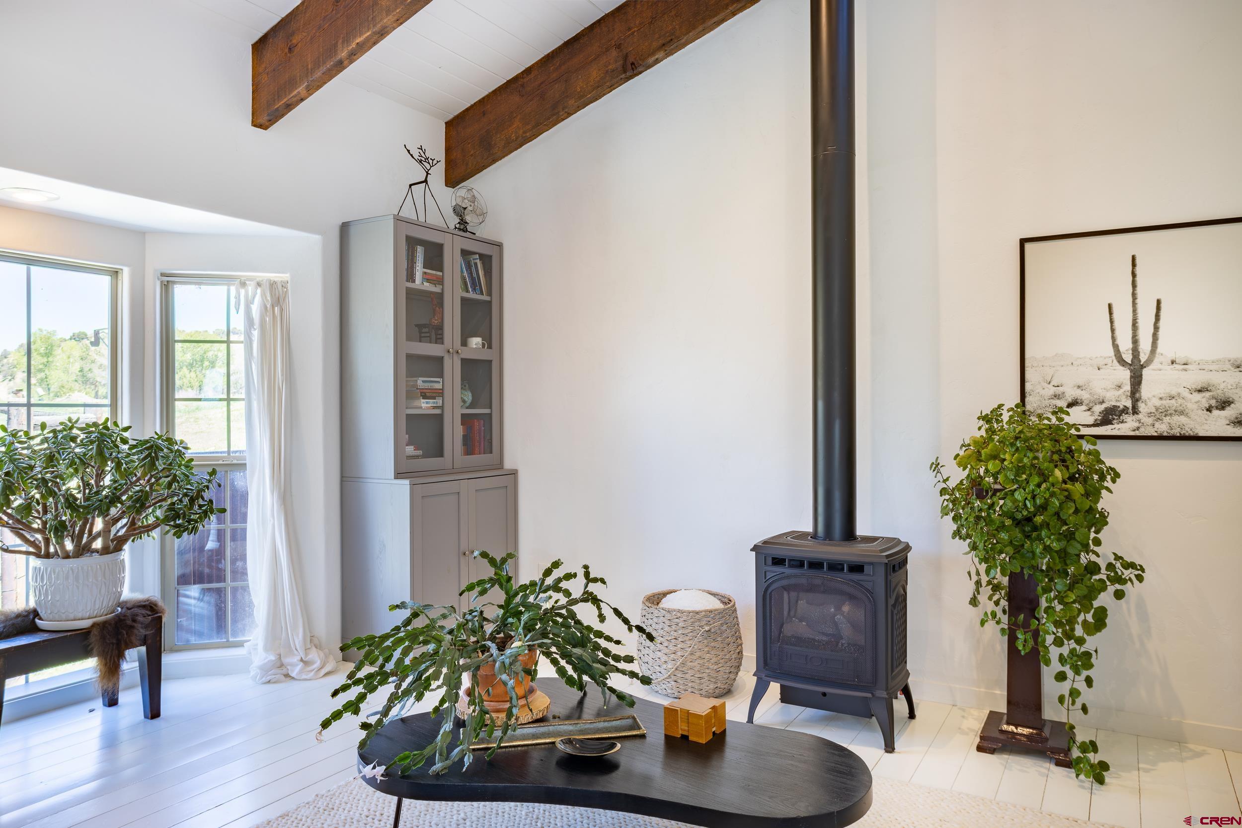 42224 Foothills Road Paonia, CO 81428 - Photo 7 of 40 a living room with furniture potted plant and a window