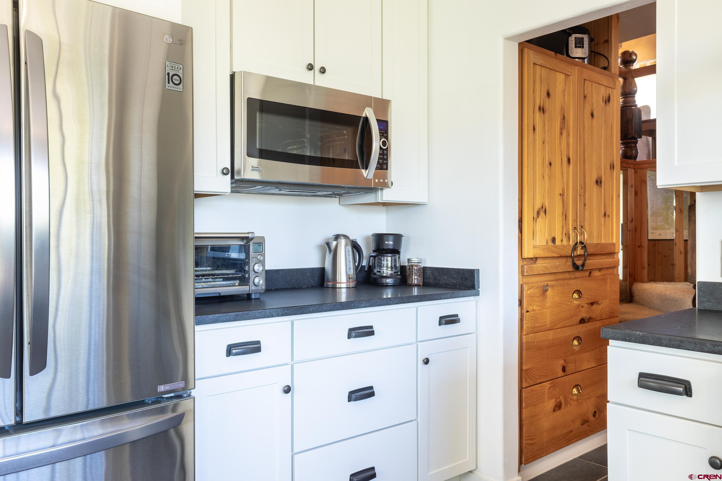 42224 Foothills Road Paonia, CO 81428 - Photo 10 of 40 a kitchen with stainless steel appliances a stove microwave and sink