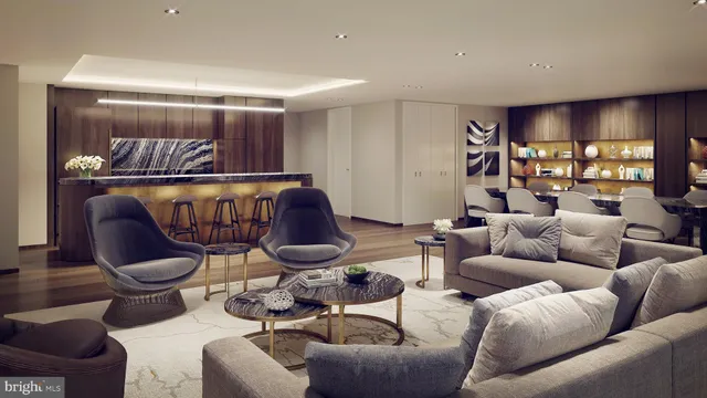 a living room with furniture a rug and a window