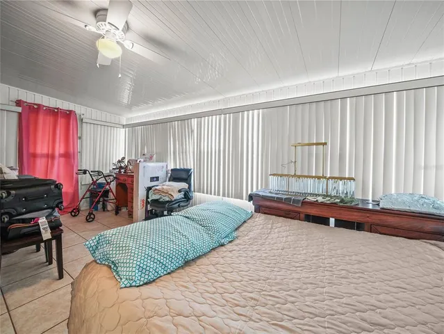 a bed room with a bed and furniture