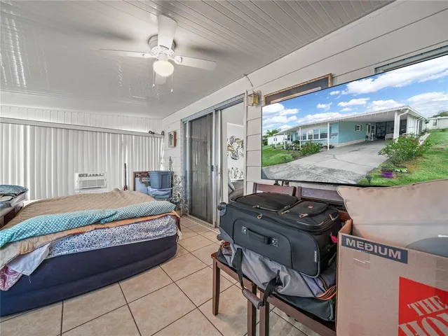 a utility room with a refrigerator and washer