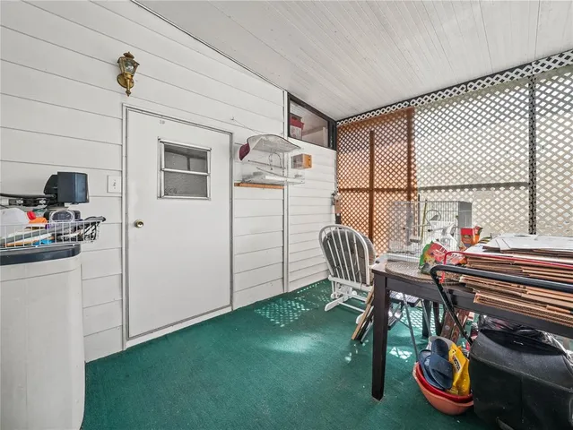 an aerial view of a house with garden space and street view