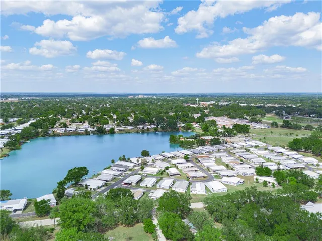 a view of a lake in middle of a city