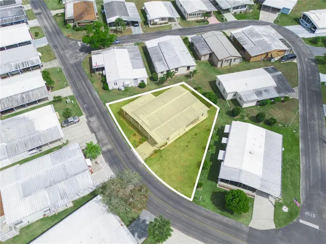 an aerial view of a house with a swimming pool
