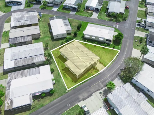 a living room with furniture potted plant and a window
