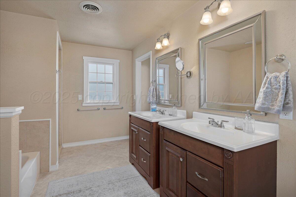2007 6th Avenue Canyon, TX 79015 - Photo 13 of 33 a bathroom with a sink double vanity and a mirror