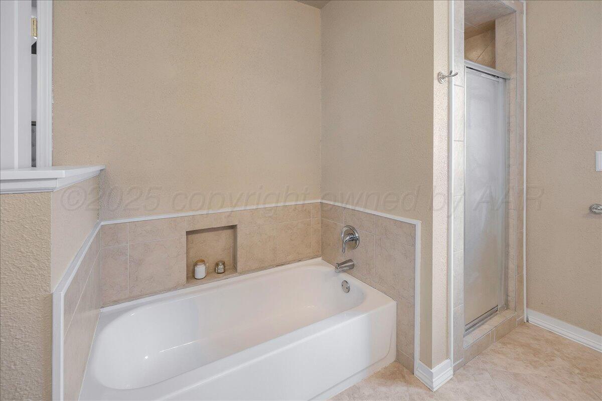 2007 6th Avenue Canyon, TX 79015 - Photo 14 of 33 a white bath tub sitting next to a white sink