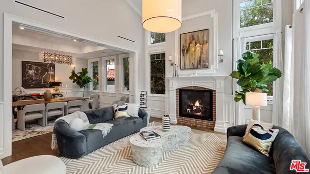 a kitchen with stainless steel appliances granite countertop a sink a stove and a wooden floors