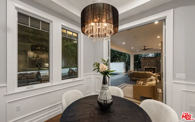 a living room with furniture wooden floor and a fireplace