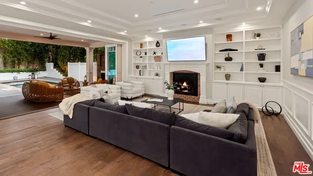 a view of terrace with seating area and trees in the background