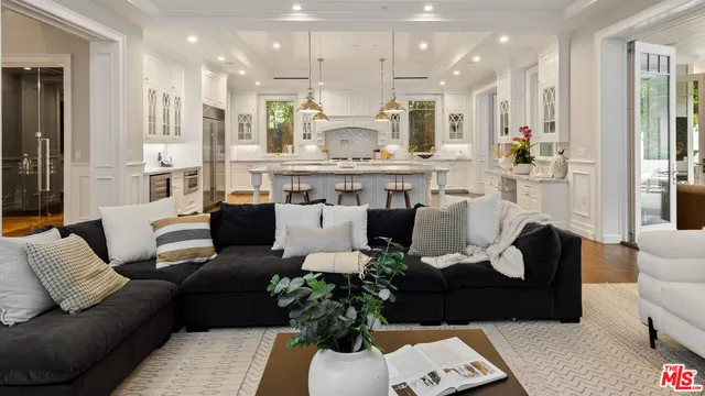 a bedroom with bed and flat screen tv