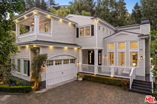 a view of a patio with couches dining table and chairs with wooden floor and fence