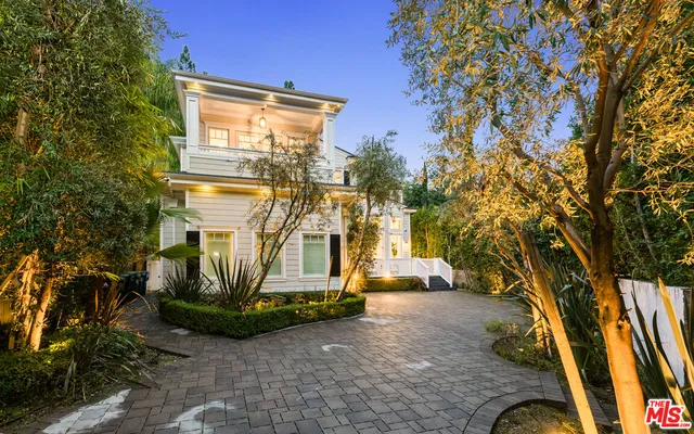 a view of a chairs and table in patio
