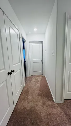 a bathroom with a sink a toilet a mirror and bathtub