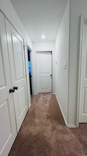 304 The Bad Way Jarrell, TX 76537 - Photo 11 of 26 a view of hallway with an empty space