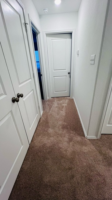 304 The Bad Way Jarrell, TX 76537 - Photo 12 of 26 an entryway door with a hallway in the house