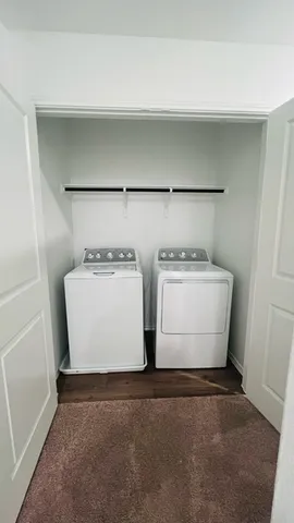 an entryway door with a hallway in the house