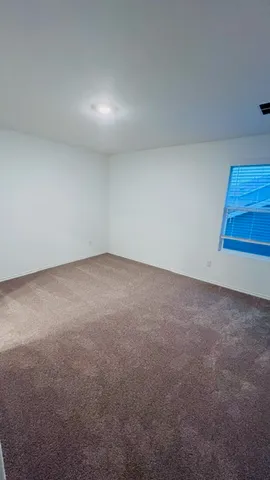 a utility room with two washing machine