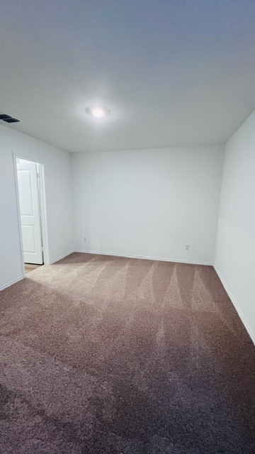 304 The Bad Way Jarrell, TX 76537 - Photo 16 of 26 an empty room with a natural light