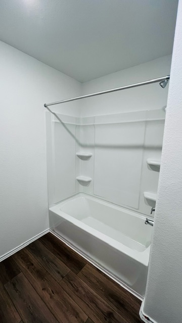 304 The Bad Way Jarrell, TX 76537 - Photo 17 of 26 a bathroom with a bathtub