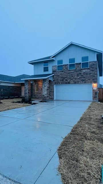 304 The Bad Way Jarrell, TX 76537 - Photo 2 of 26 a view of a house with a street
