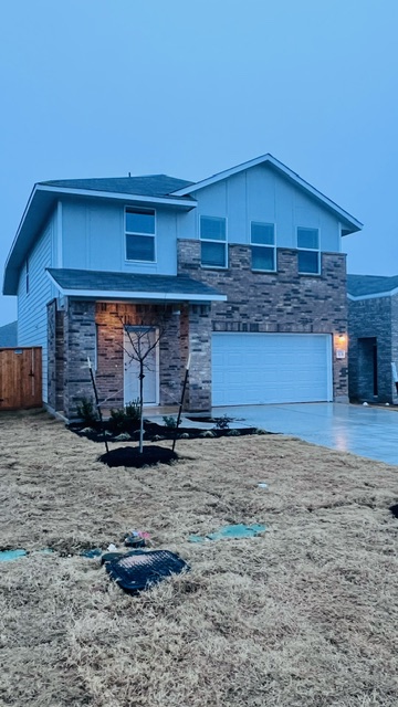 304 The Bad Way Jarrell, TX 76537 - Photo 3 of 26 a front view of a house with parking