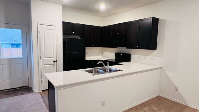 304 The Bad Way Jarrell, TX 76537 - Photo 7 of 26 a bathroom with a sink and a mirror