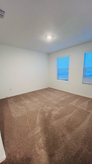 304 The Bad Way Jarrell, TX 76537 - Photo 8 of 26 an empty room with windows