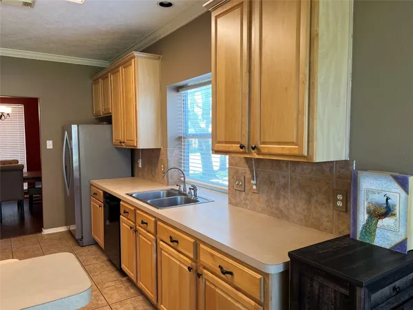 a kitchen with a stove a sink and a microwave