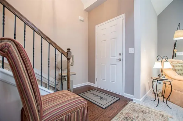 a bedroom with furniture and a flat screen tv