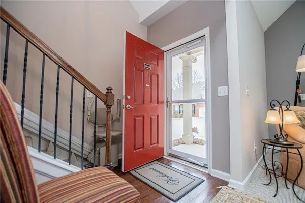 a vase of flowers sitting on a table in front of a window