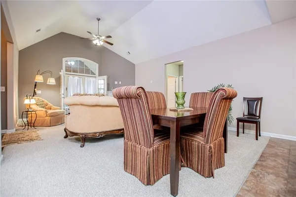 a bedroom with a bed and a potted plant