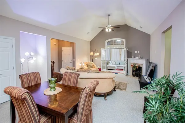a bedroom with a bed and a television