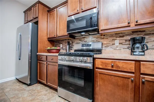 a bedroom with a bed and a tv