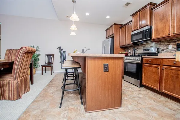 a bedroom with a bed a couch and a ceiling fan