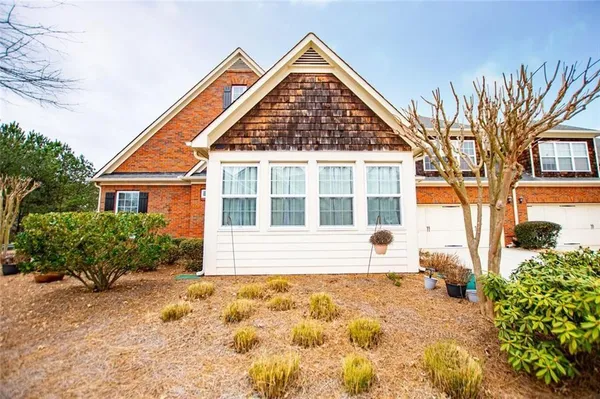 a kitchen with stainless steel appliances granite countertop a stove microwave and refrigerator