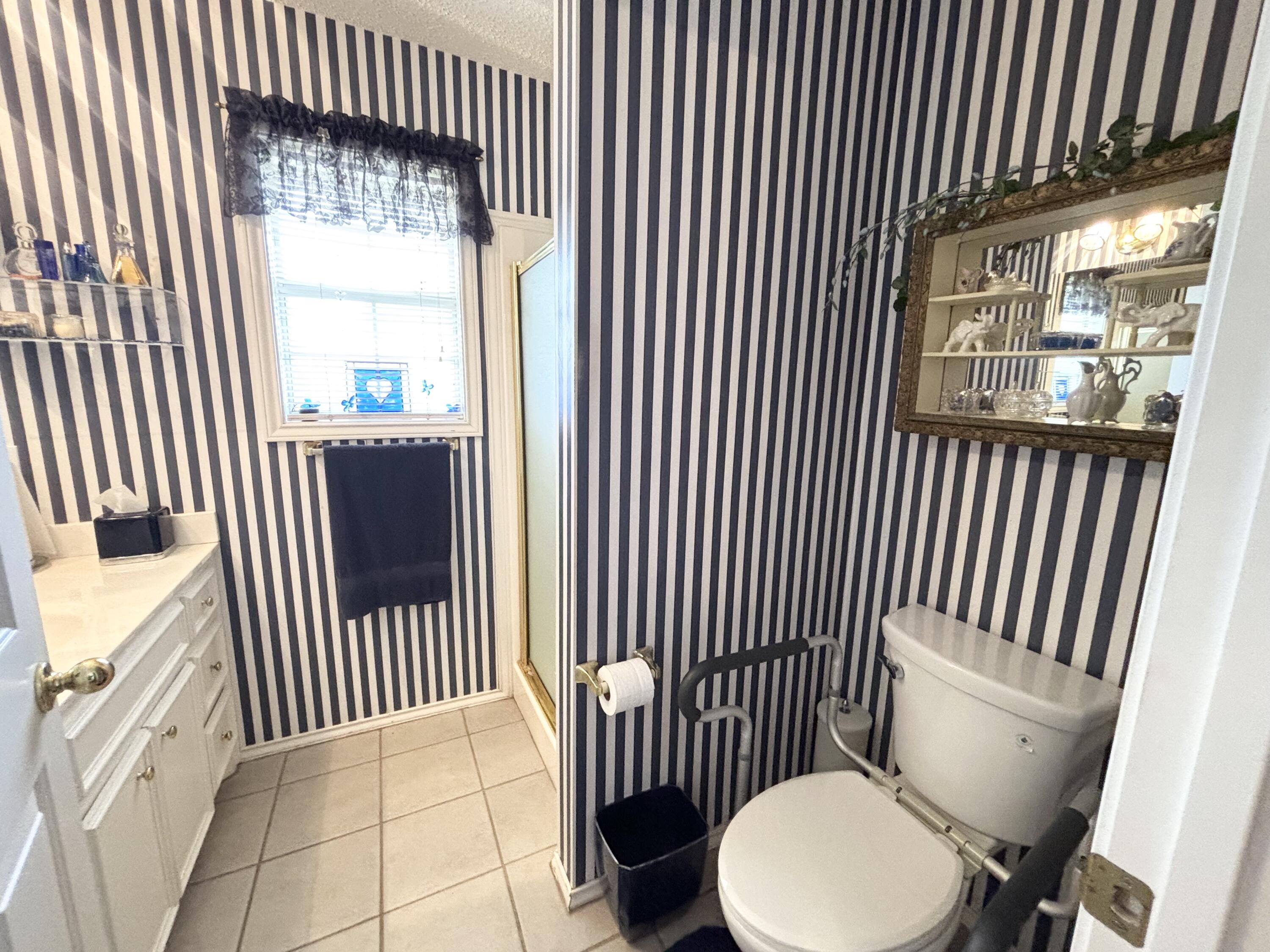 306 Ave M Abernathy, TX 79311 - Photo 16 of 22 a bathroom with a toilet and a sink